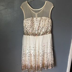 Cream colored homecoming dress.